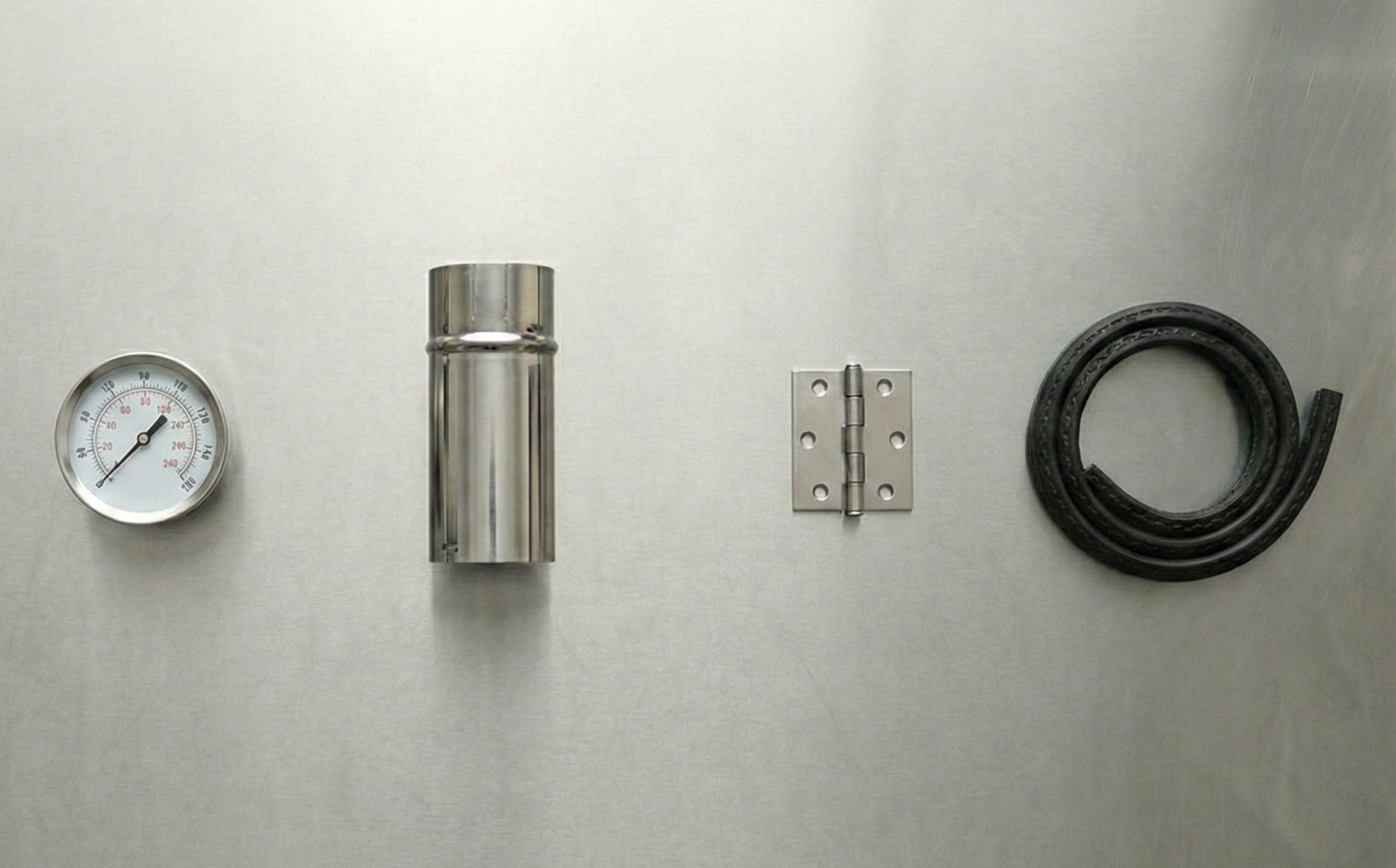 Metal components including a thermometer, chimney, hinge, and gasket on a light gray background